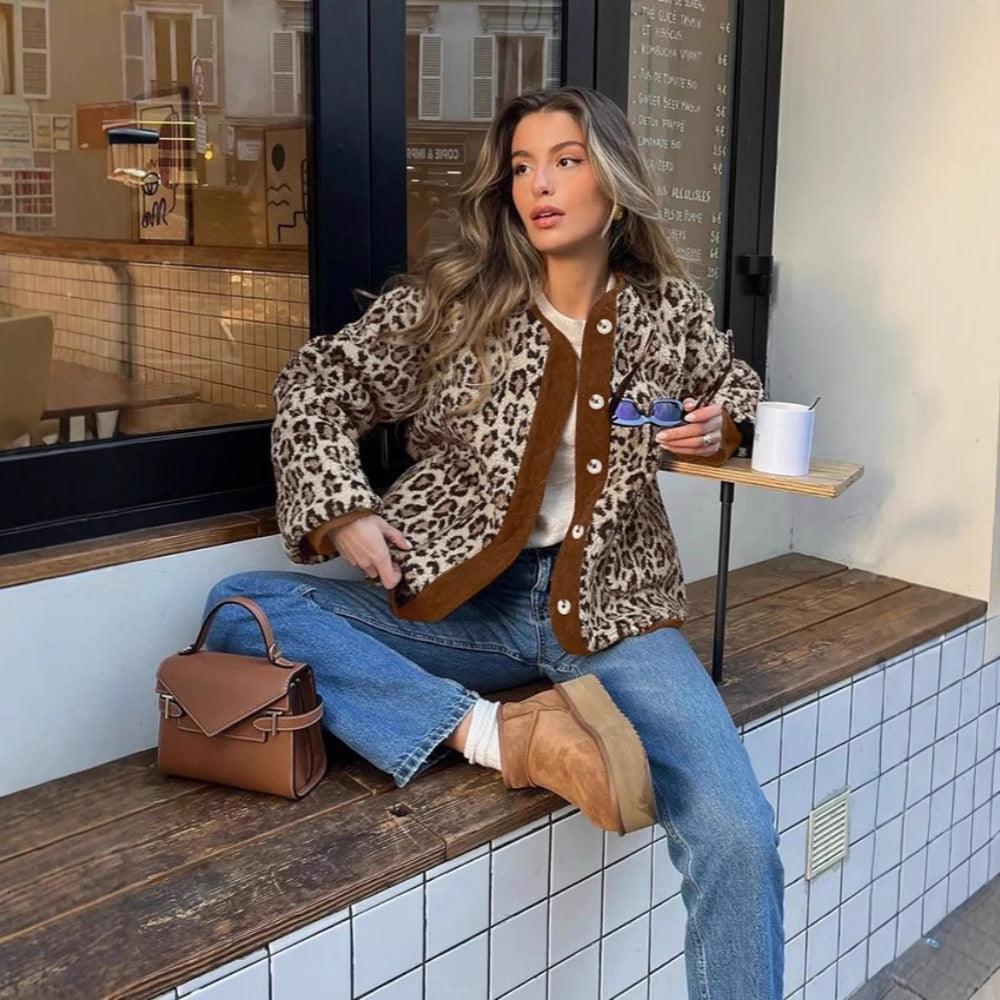 Leopard print button-up coat with brown contrast trim and snap buttons