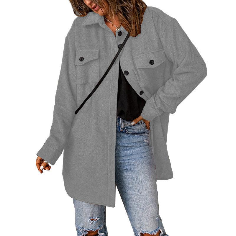 Light grey woolen lapel jacket with button front, chest flap pockets, and long sleeves