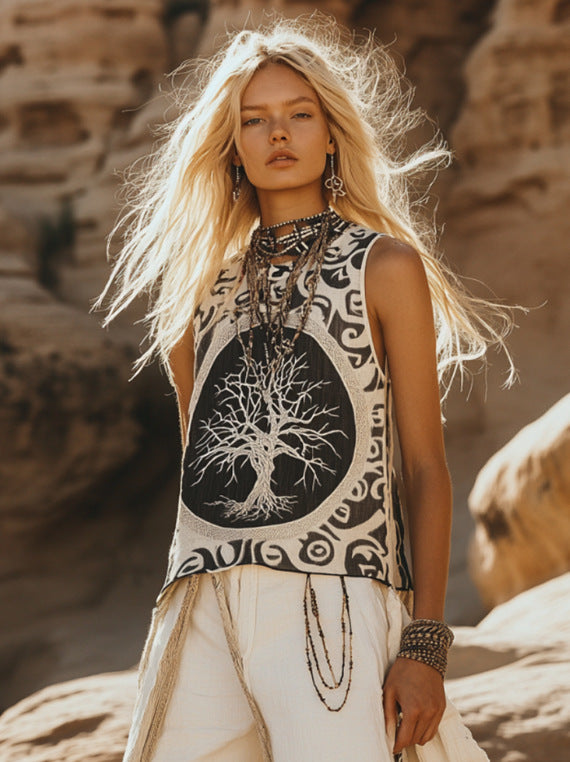 Sleeveless black-and-cream printed top with ornate border, paired with white drawstring pants