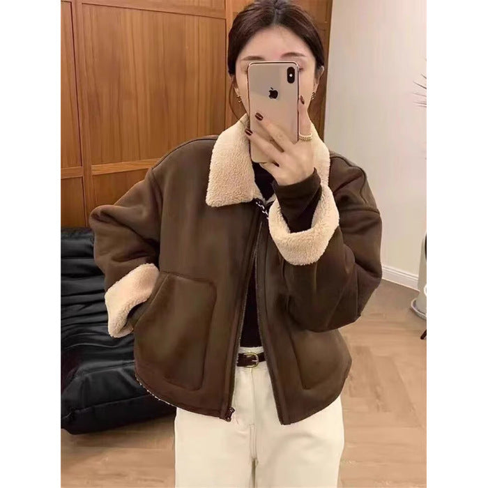 Brown short zip jacket with plush sherpa collar, flap pockets, and belt detail