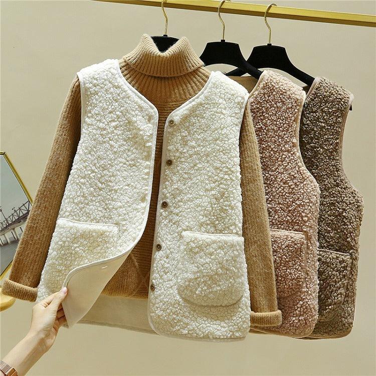 Beige lamb plush fur vest with ribbed turtleneck, snap front, and two chest pockets