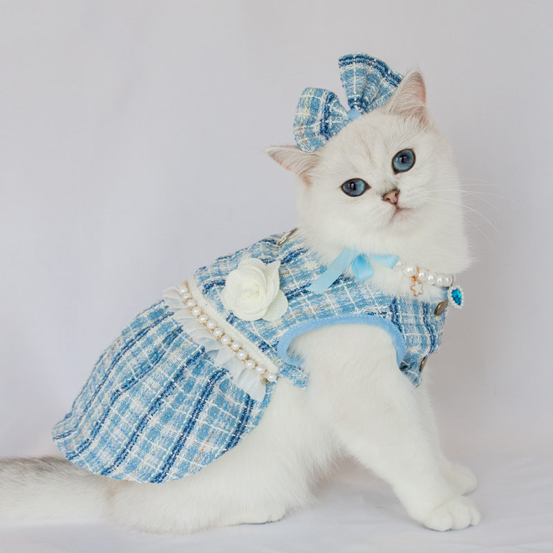 Blue tweed cat dress with white rose detail, bow headdress, and pearl necklace charm