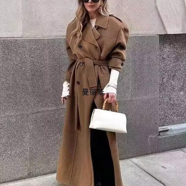 Mid-length wool coat with belt, tan, shirt collar and button front.