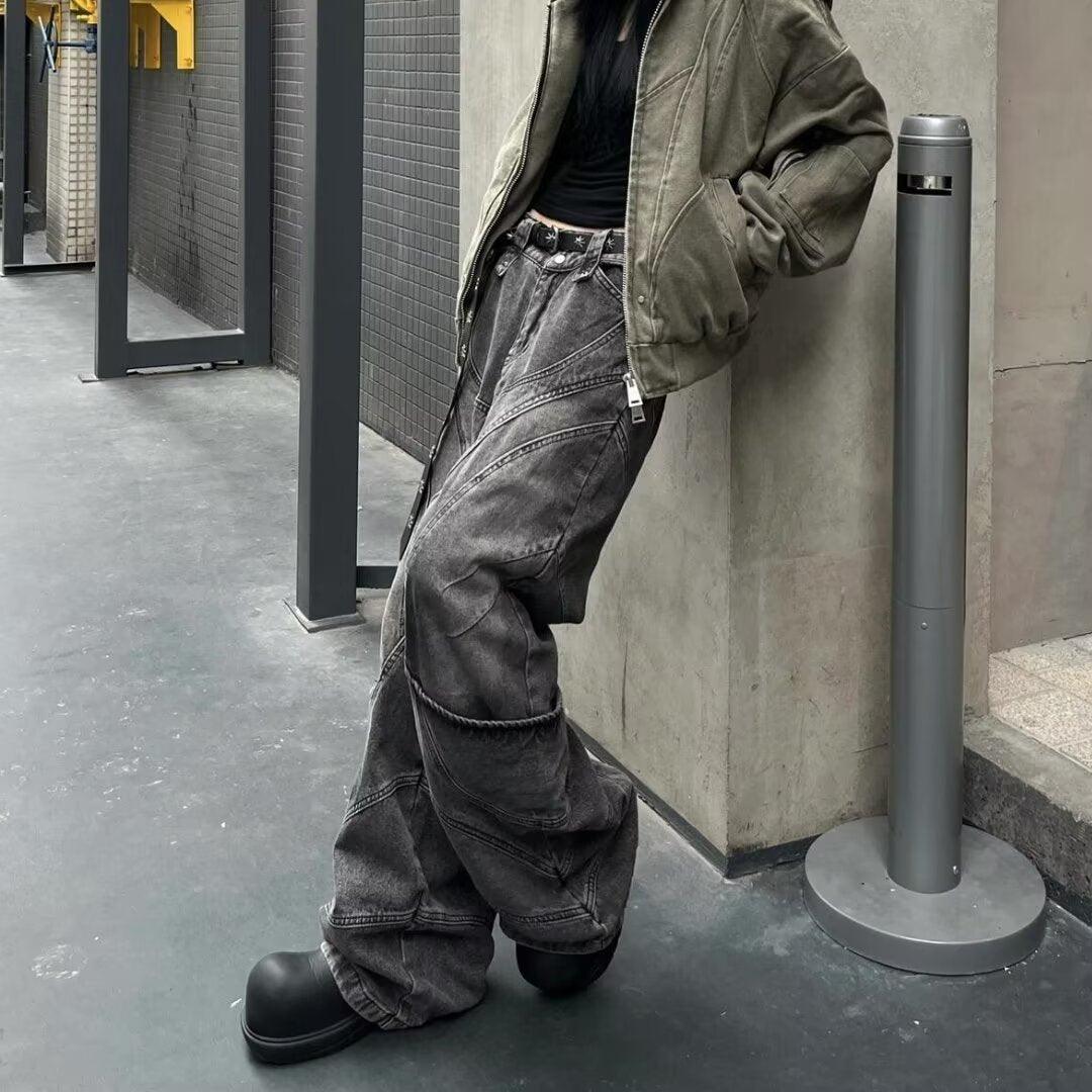 Dark gray multi-pocket denim overalls with wide legs and cuffed hems
