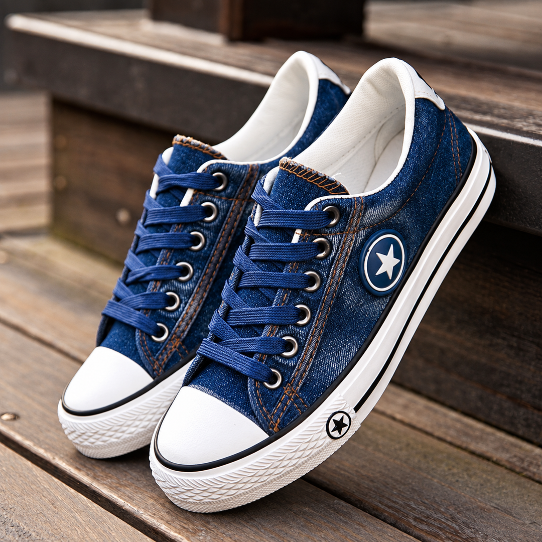 Blue denim low-top sneakers with white toe caps