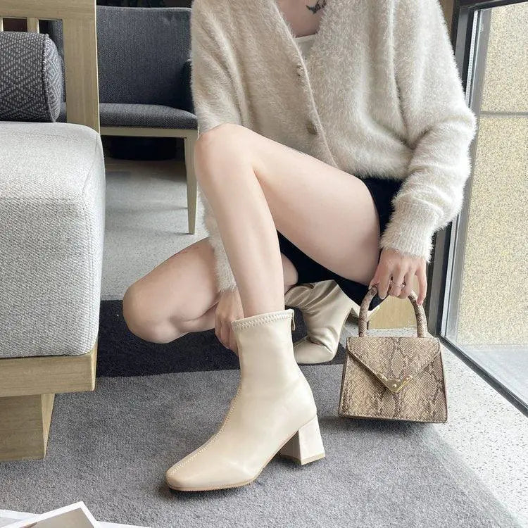 Soft leather cream ankle boots with chunky block heel and almond toe pull-on