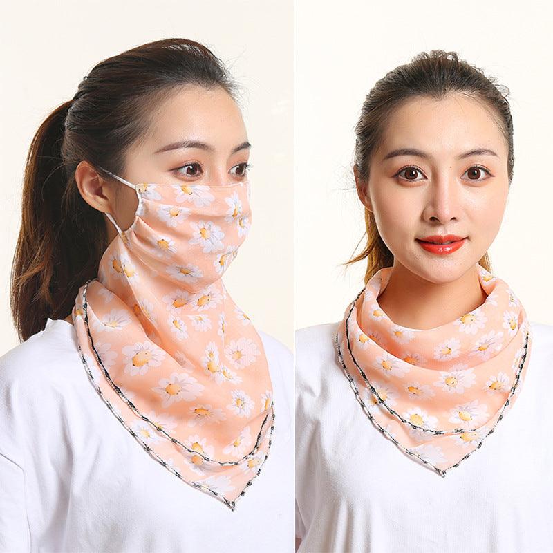 Peach-orange floral bib scarf with matching face covering, draped at the neck