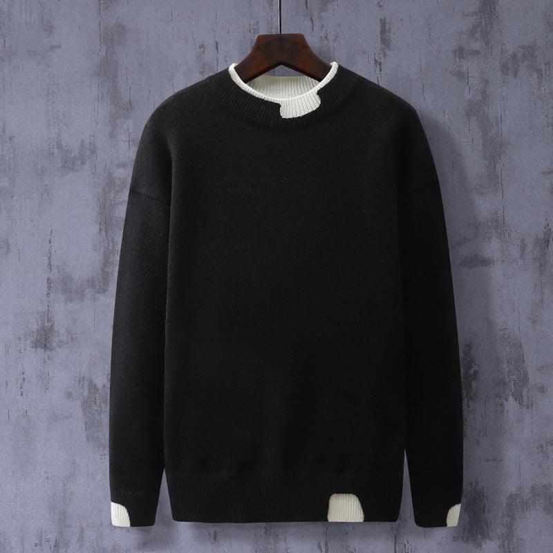Black knit crewneck sweater with long sleeves and ribbed hem