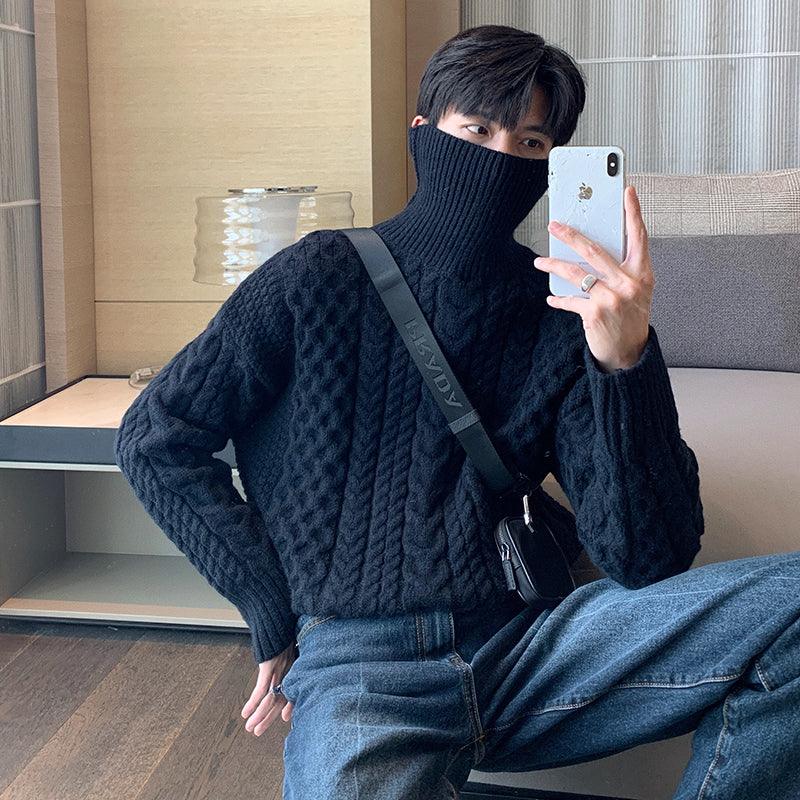 Dark navy turtleneck cable-knit sweater with ribbed turtleneck and long sleeves