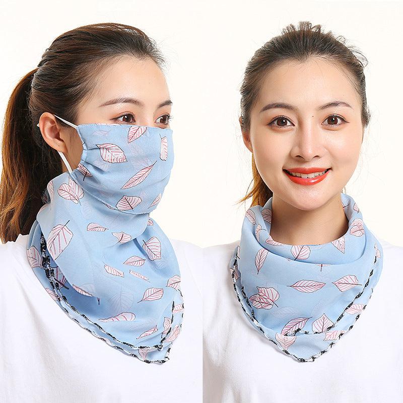 Light blue floral bib scarf with matching face covering, draped around neck and mouth