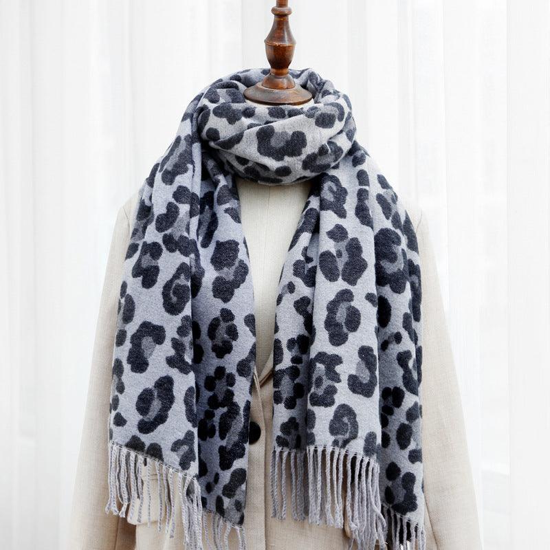 Double-sided leopard print scarf in dark grey with black spots and fringe ends