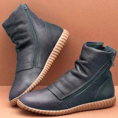 Navy blue side-zip flat-bottom boots with flat sole, stitched panels, and side zipper