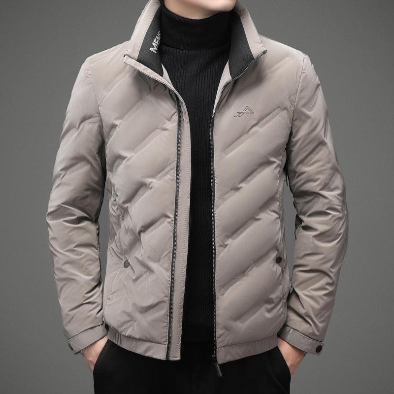 Youth down jacket in light gray with zip-up front and stand collar.