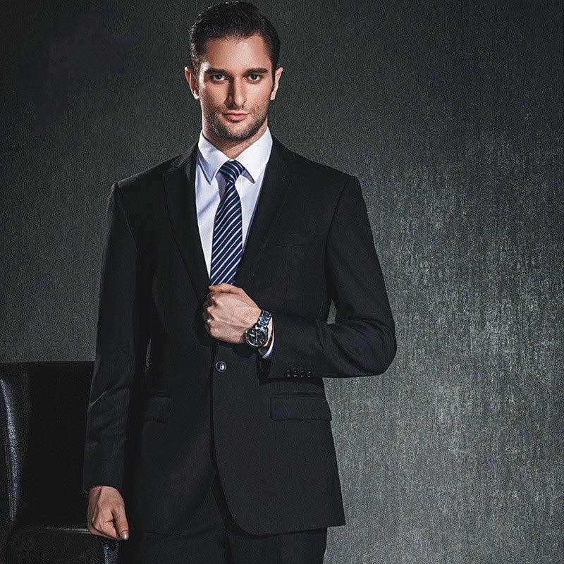 Men’s black suit jacket with dress shirt and navy striped tie