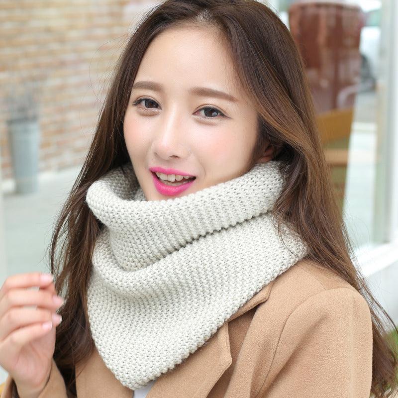 Thick knit ladies scarf cowl, off-white/cream chunky knit with ribbed texture.