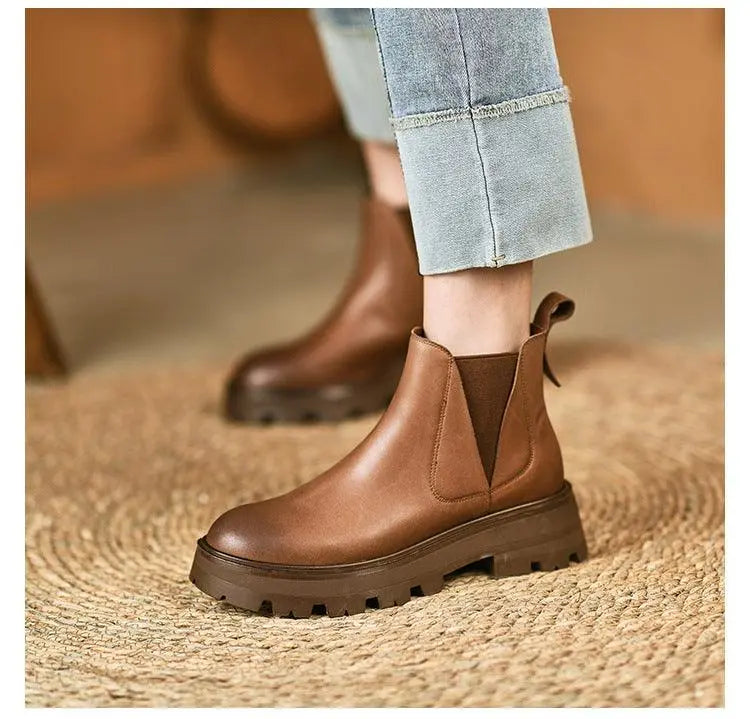 Brown soft leather ankle boot with elastic side gore and thick tread sole