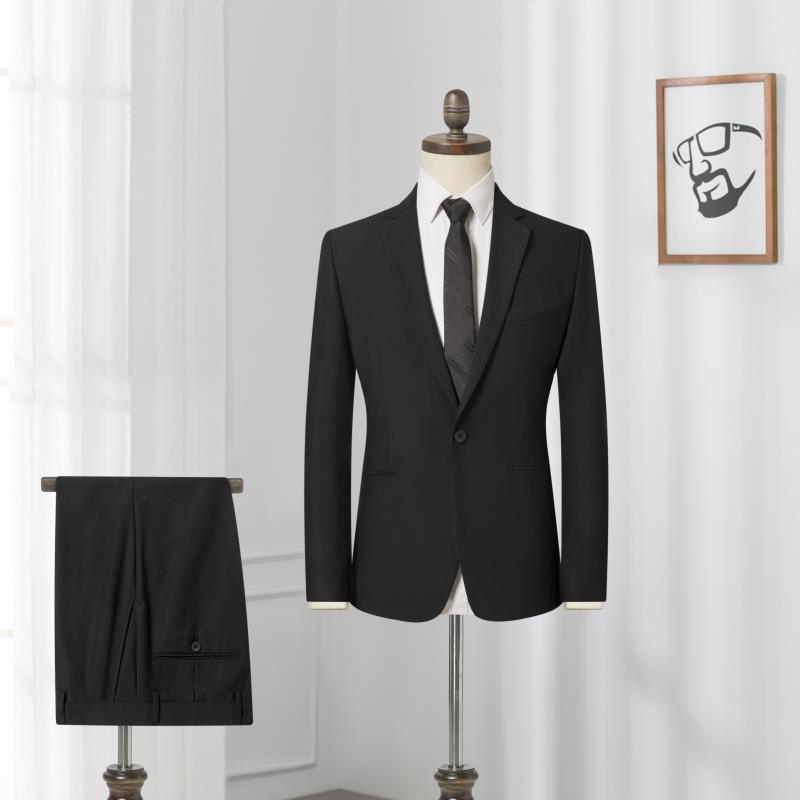 Black men's suit jacket with matching trousers folded on side of mannequin