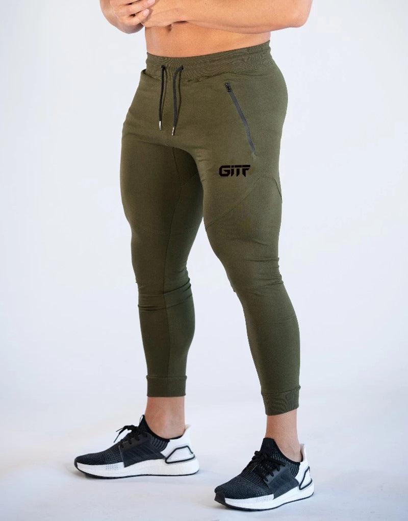 Army green sport pencil pants with drawstring waist, slim fit, and cuffed hems.