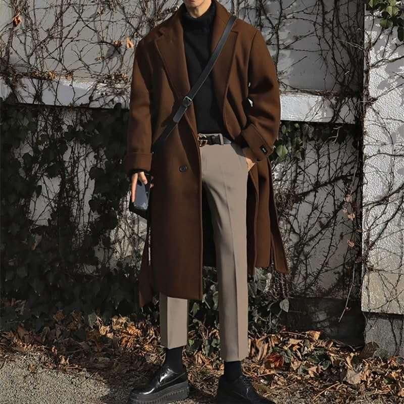 Brown mid-length trench coat with notched lapels, button front, and waist belt