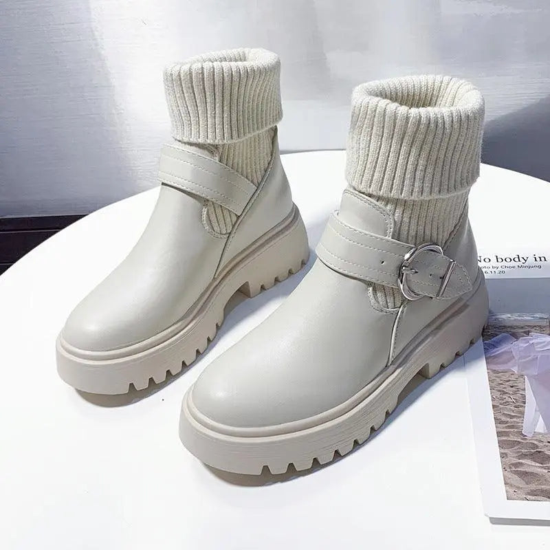 Pair of women's non-slip white ankle boots with knit cuffs and side buckle straps