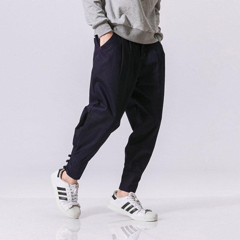 Navy cotton-linen harem pants with elastic waist, gathered knees, and side pockets