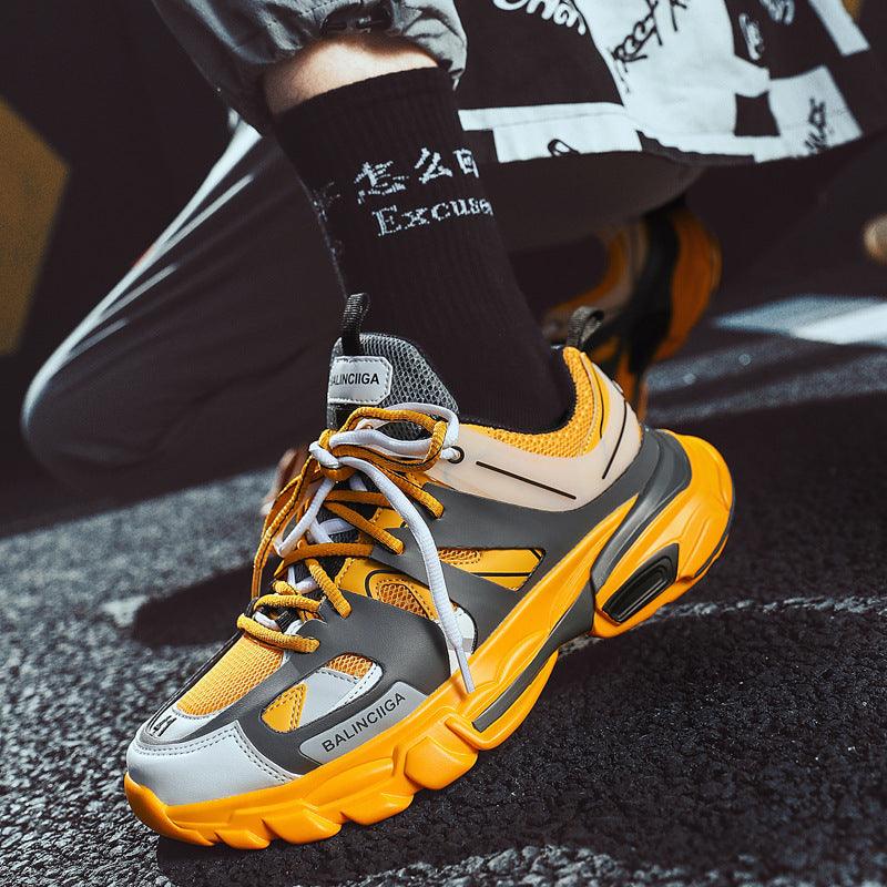 Breathable sneakers for women in yellow, orange, and white with chunky black sole