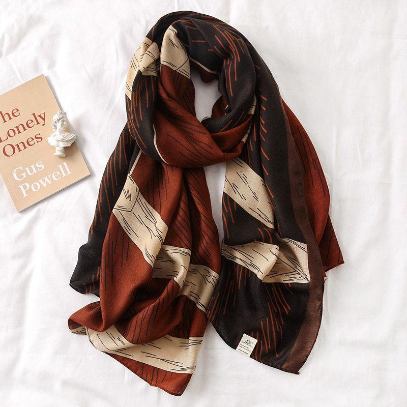 Silk scarf with rust-brown and cream abstract lines print, lightweight drape