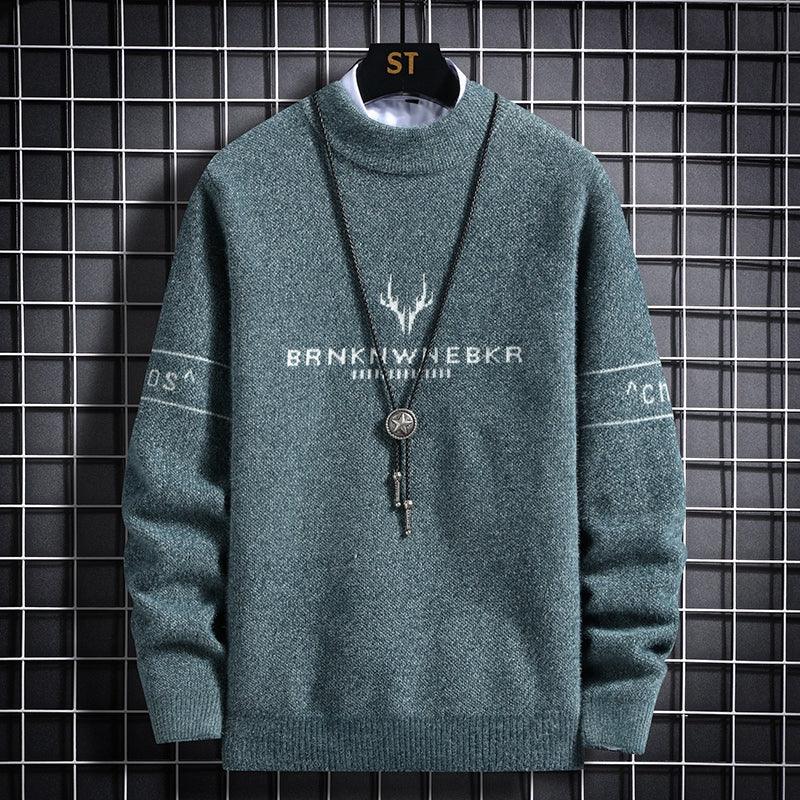 Men's teal knit sweater with graphic crest and pendant-style necklace print