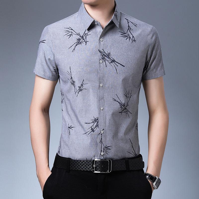 Men's grey short-sleeve button-up shirt with black bamboo-style print, front view