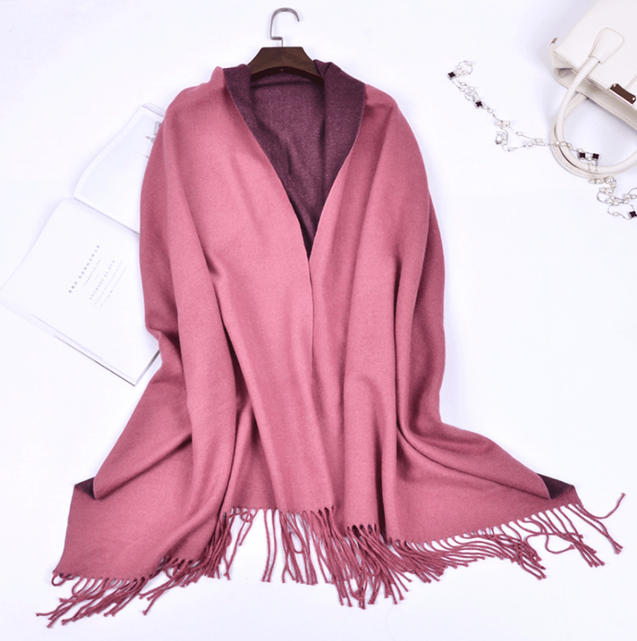 Warm cashmere scarf in dusty rose with dark maroon tone and fringed hem.