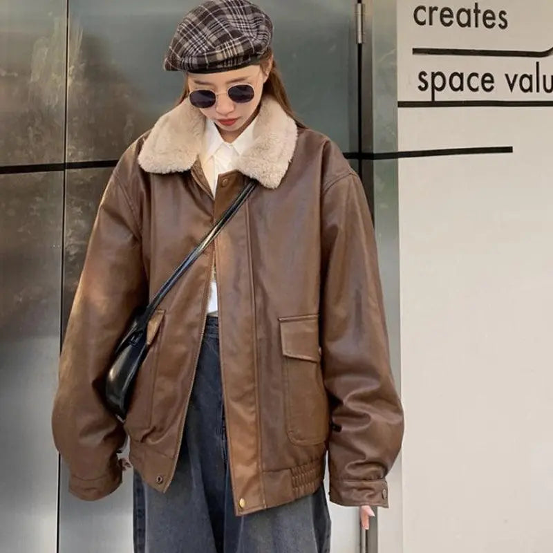Coffee-brown leather-look jacket with sherpa lining, button front, and chest patch pocket