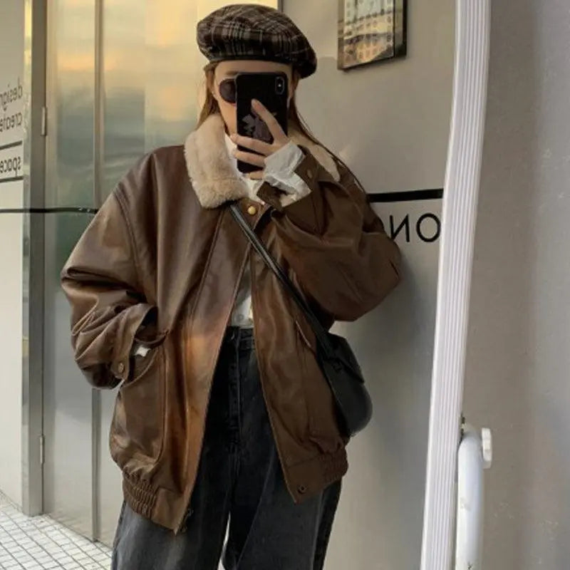 Coffee-brown leather-look jacket with sherpa collar, button front, and flap pockets