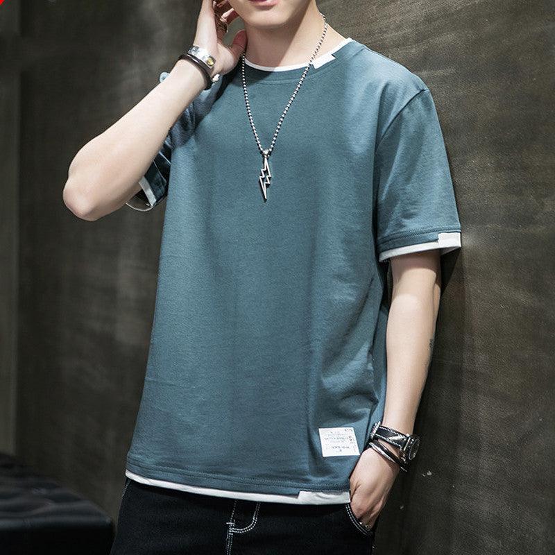 Men's short sleeve t-shirt in teal with white-trim hem and crew neck.