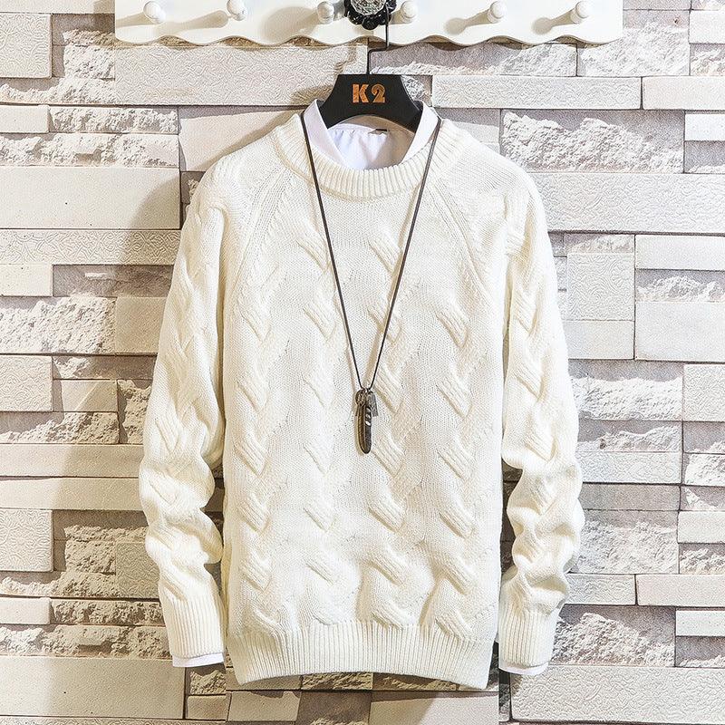 White cable-knit round-neck sweater with long sleeves and ribbed cuffs