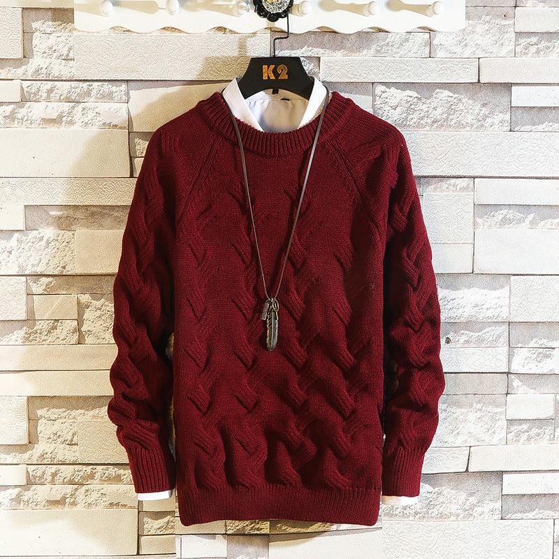 Wine red cable-knit round-neck sweater with long sleeves and ribbed cuffs