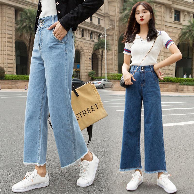 Light blue high-waisted straight-leg jeans with button fly detail and frayed hem