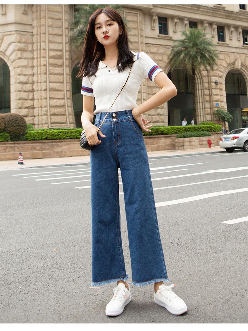 Dark blue high-waisted straight-leg jeans with frayed cuffs and wide leg