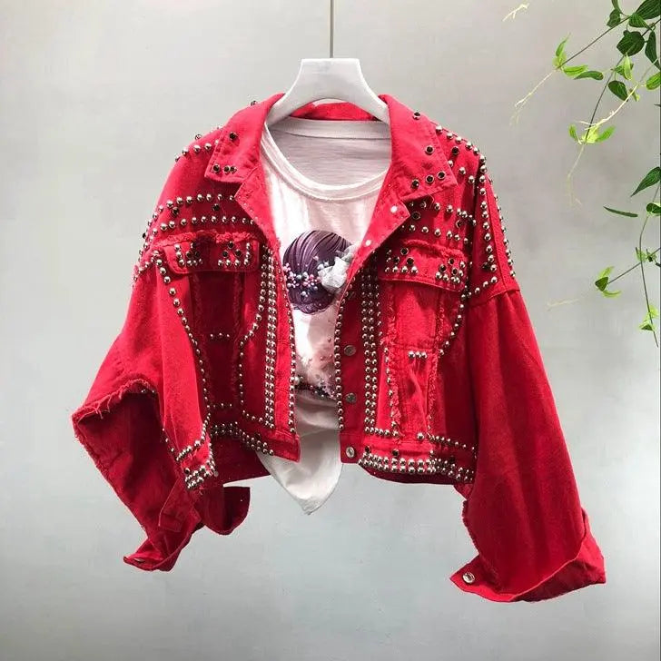 Red studded jacket with bold rhinestone accents, cropped fit, and button-front closure