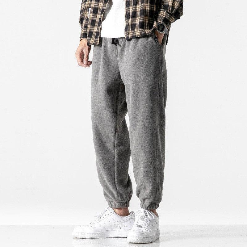 Grey harem pants with tapered jogger legs and elastic cuffs