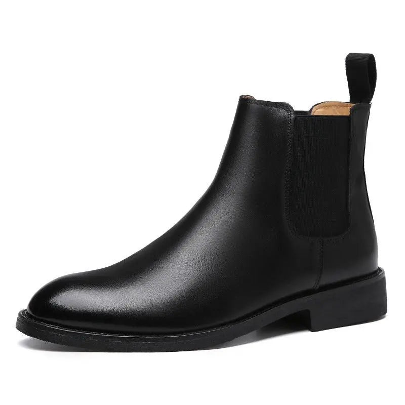 Black Chelsea ankle boots with elastic gore panels, rounded toe, and pull tab