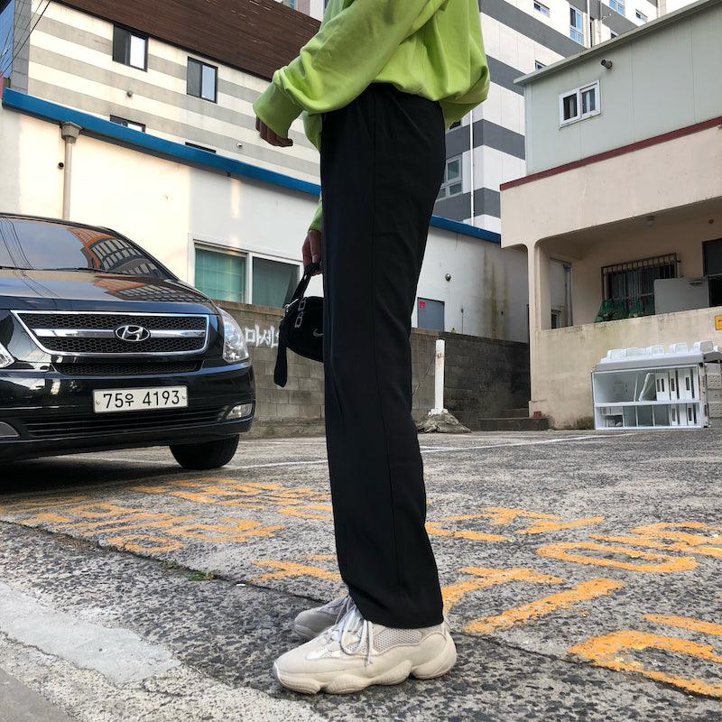 Black straight suit trousers with belt loops, wide straight legs, and full-length hem