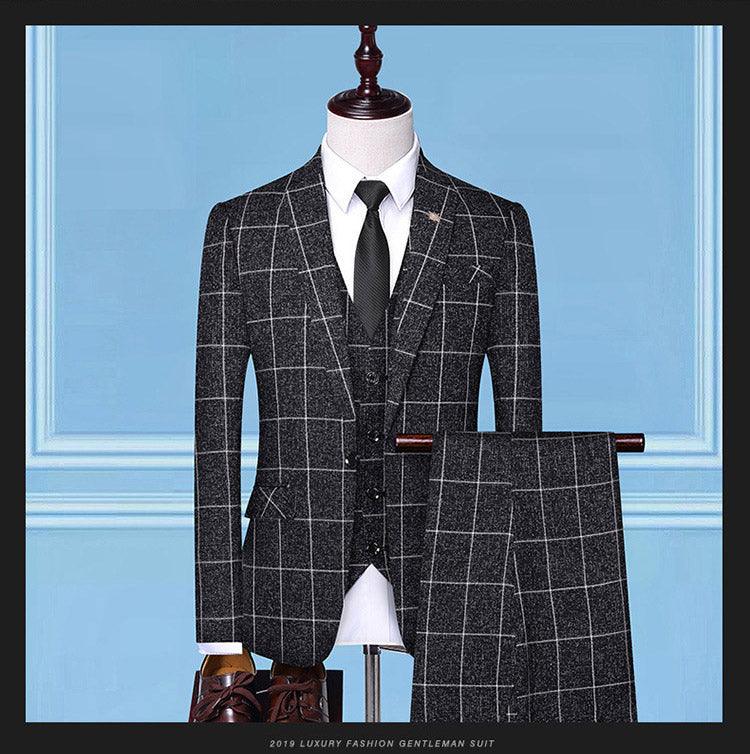 Men's 3-piece suit in dark charcoal windowpane plaid with matching vest and black necktie