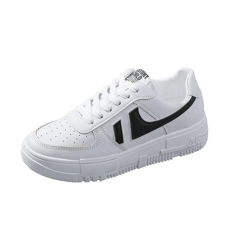 White sneakers with black side accents, lace-up front, and thick white sole