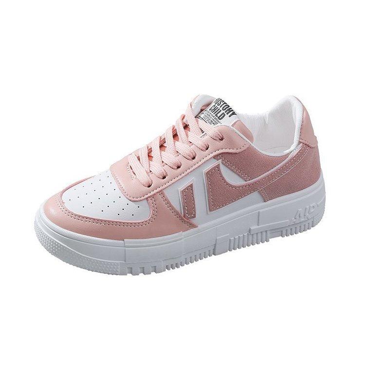 Blush pink sneakers with light pink panels and lace-up front, with white sole