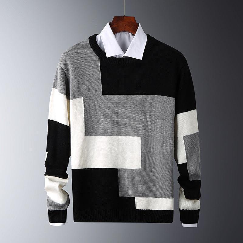 Black, grey, and white color-block knit sweater with ribbed cuffs and hem