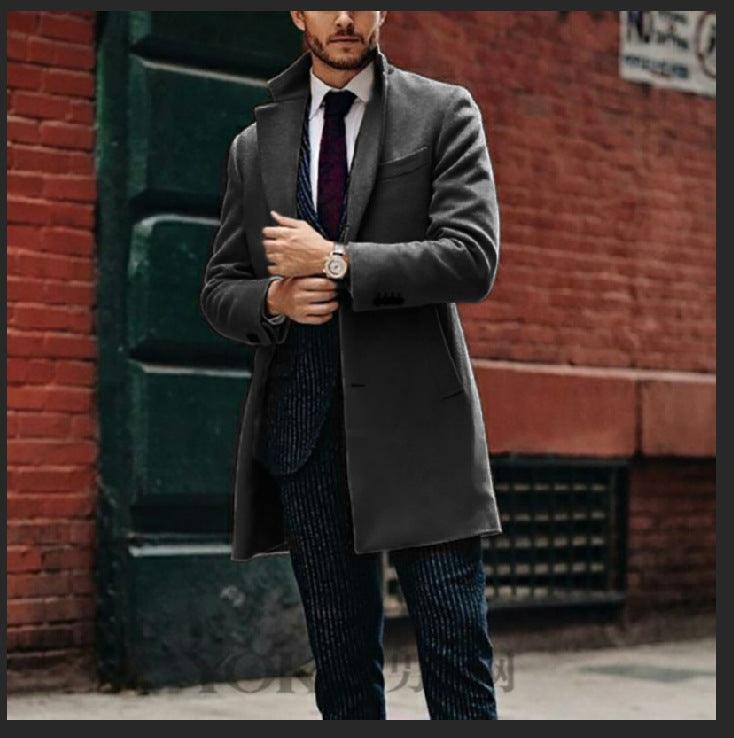 Men's mid-length double-breasted wool coat, charcoal grey with notch lapels and flap pockets.