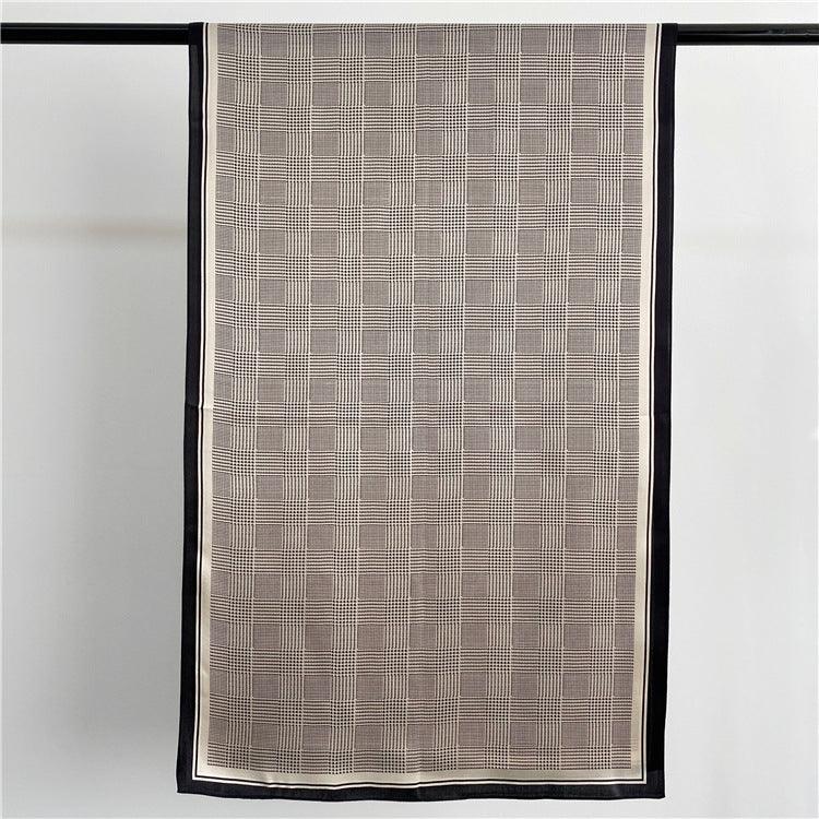 Long silk scarf with black-and-white houndstooth pattern and black edge border