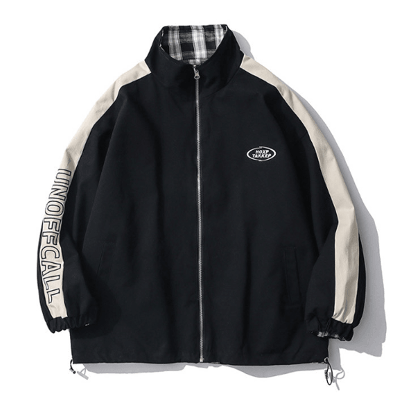 Black reversible stand-collar jacket with full zipper, white side panels, and chest logo patch.