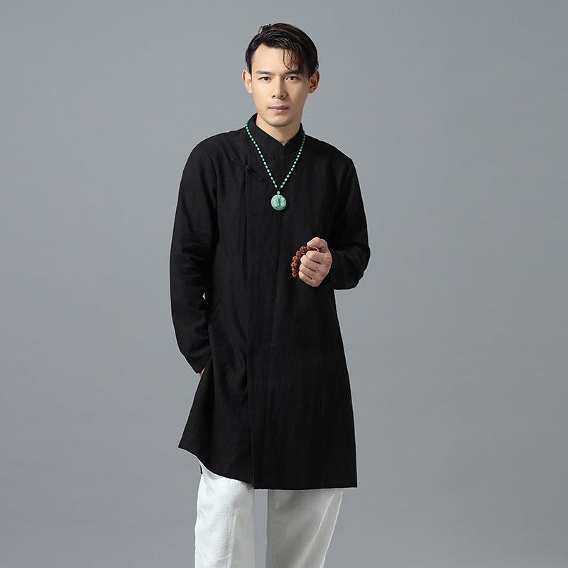 Black ramie tunic shirt with banded collar and long sleeves, worn with white pants.