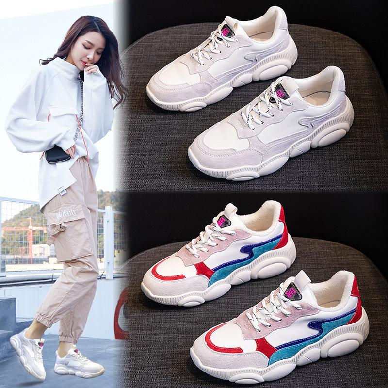 White chunky sneakers with gray panels and multicolor side accents